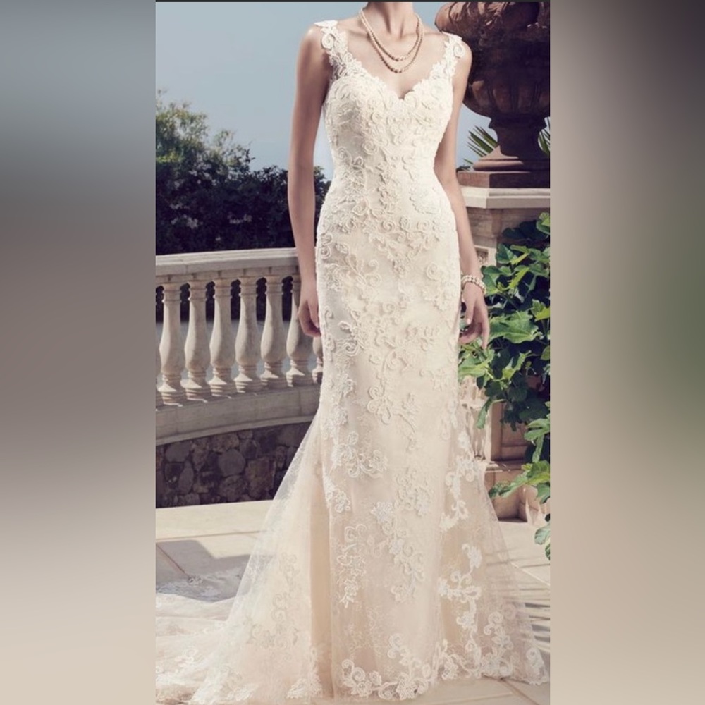 New with tag wedding gown with beautiful belt included at no additional charge